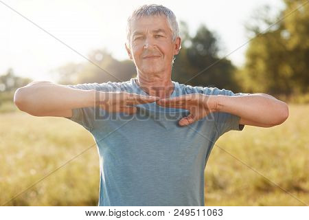 People, Healthy Lifestyle And Pension Concept. Satisfied Refreshed Grey Haired Senior Man Stretches 