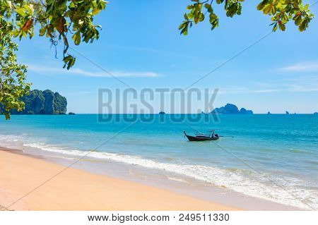Longtail Boat In Sea At Aonang Beach Against Sky On Sunny Day