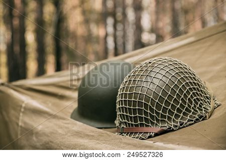 Metal Helmet Of United States Army Infantry Soldier At World War Ii. Helmet  On Camping Tent In Fore