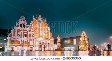 Riga, Latvia. Town Hall Square, Popular Place With Famous Landmarks On It In Bright Evening Illumina