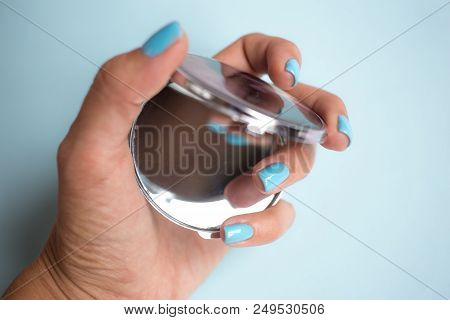 Compact Mirror In Women's Hands With Manicure . Makeup Female Accessories