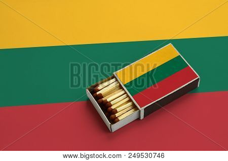 Lithuania Flag  Is Shown In An Open Matchbox, Which Is Filled With Matches And Lies On A Large Flag.