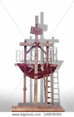 A Wooden Crusifixion Cross On A White Background