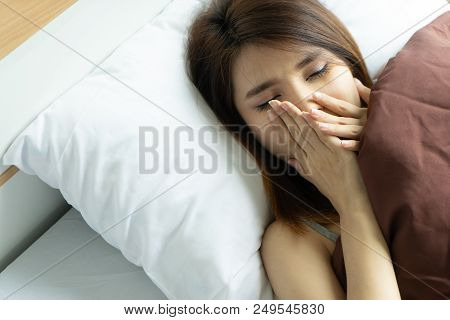 Young Woman Yawn Awakening Tired Holding Alarm Clock. Wake Up Early In Morning. Girl Stop Snooze Ala