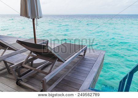 Beautiful Tropical Maldives Island Summer Vacation Relaxing At Overwater Villa In Luxury Resport.