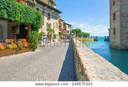Sirmione, Italy - August 10, 2008: Garda Lake, Tourists In The Street In Front Of The Rocca Scaliger