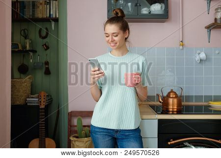 Indoor Closeup Of Young Positive European Caucasian Lady Spending Afternoon At Home Chatting With Fr