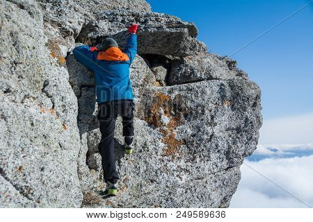 Tourist Climbs The Rock. Demerdzhi Mountain, Crimea