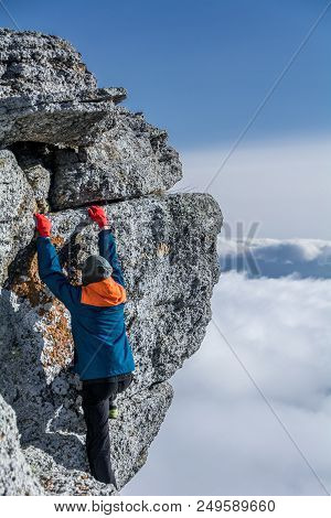 Tourist Climbs The Rock. Demerdzhi Mountain, Crimea