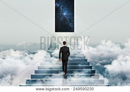 Business Success Concept And Win With Businessman Climbing Up Stairs To The Success With Opened Door