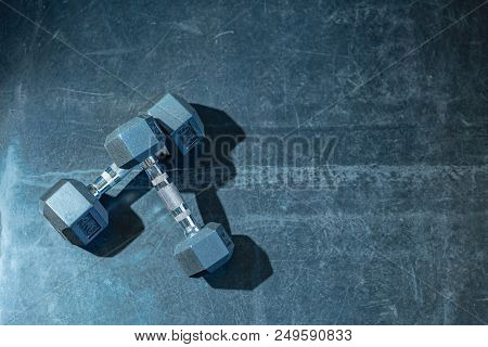Selective Focus On Dumbbell, Healthy Concept, 2 Dumbbells On Rough Texture Background With Effect Fi