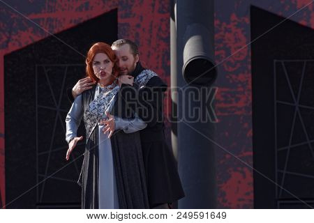 ST. PETERSBURG, RUSSIA - JULY 15, 2018: Dmitry Kondratiev as Macbeth (right) and Julia Gertseva as Lady Macbeth in the opera Macbeth outdoors during the festival All Together Opera