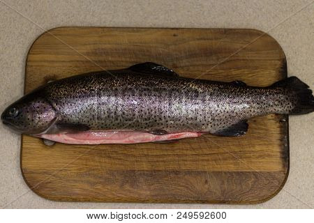 Raw Fish. Raw Fresh Salmon On A Table On A Cutting Board. Kitchen