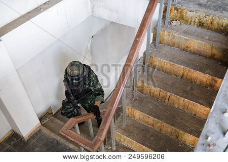Special Forces Armed Marksmen With Weapon In Building During A Special Operation.
