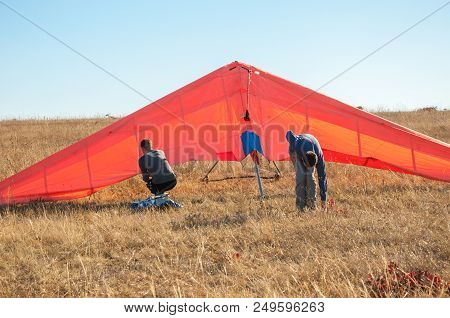Two People Start A Glider In The Sky