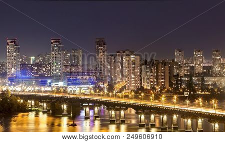 Kyiv (kiev) City, The Capital Of Ukraine At Night Beside The Dnipro (dniepr) River With Reflection I