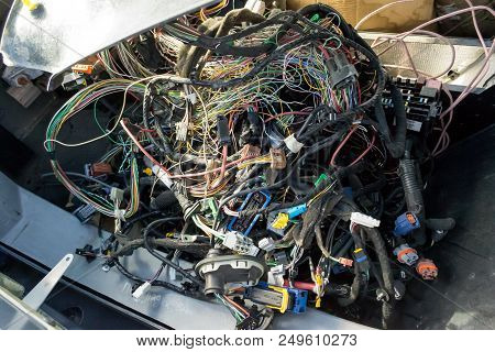 A Large Tangle Of Ravel Multicolored Wires From The Car Wiring Lies In The Cabin Of The Dismantled C