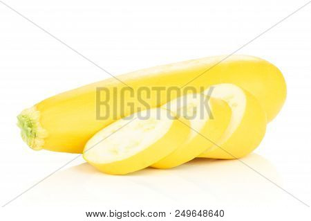 Group Of One Whole Three Slices Of Raw Yellow Zucchini Isolated On White