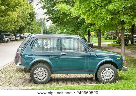 Novi Sad, Serbia. July - 12. 2018. Green Lada Niva 4x4 Off Road Car Parked On The Street. Editorial 