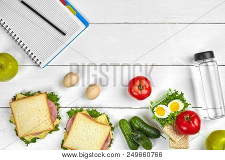 Top View Planning Notebook With Copy Space And Healthy Breakfast. Sandwich With Ham And Cheese, Eggs