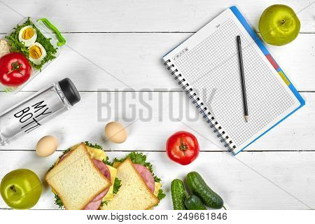 Top View Planning Notebook With Copy Space And Healthy Breakfast. Sandwich With Ham And Cheese, Eggs