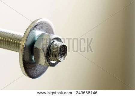 Stainless Steel Bolts And Nuts On A White Background. Bolt, Washer And Nut On A White Background. Bo