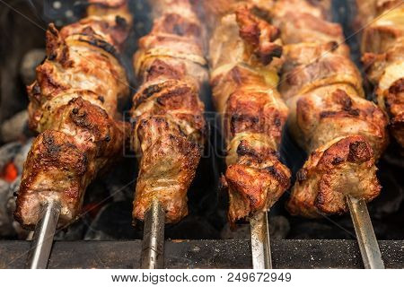 Close Up Of Just Roasted Hot Pieces Of Meat And Onion On Few Metal Skewers On Top Of Metal Brazier F