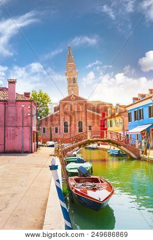 Street With Colored Houses On The Island Of Burano And With A Canal In The Middle, Near Venice, Ital