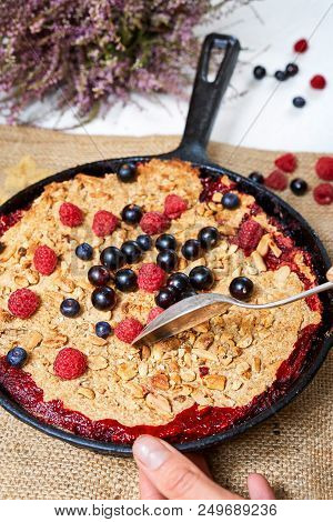 Summer Breakfast. Crumble With Blueberries In The Black Cast-iron Frying Pan On The White Table. Top