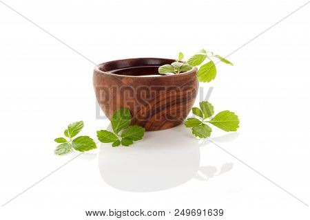 Gynostemma Pentaphyllum Leaves And Tea Isolated On White Background. Medical Herb Jiaogulan.