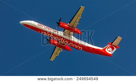 Berlin, Germany, 07.07.2018: Air Berlin Bombardier Q400 Aircraft Flying In The Sky, Tegel Airport
