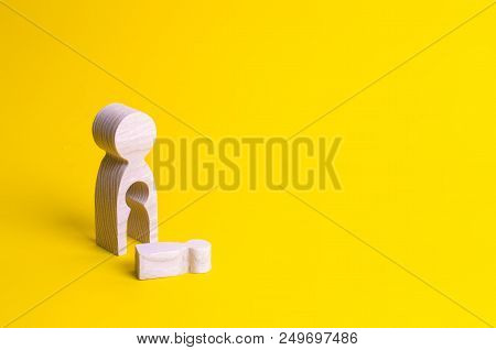 A Wooden Figure Of A Woman With A Void From Which A Child Fell. The Concept Of The Loss Of A Child, 