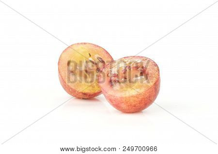 Group Of Two Halves Of Fresh Red Gooseberry Hinnomaki Variety One Sliced Flesh With Seeds Isolated O