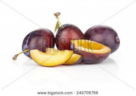 Group Of Three Whole One Half Two Slices Of Fresh Violet-blue Plum Vibrant Moyer Variety Set Isolate