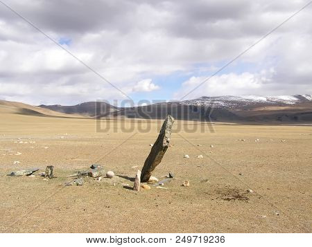 Ancient Gravestones In The Steppes Of The Mongolia. Mongolian Cemetery