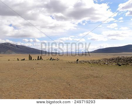 Ancient Gravestones In The Steppes Of The Mongolia. Mongolian Cemetery