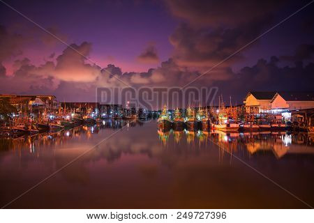 Landscape Of Fishing Ships Or Boats At Pak Nam Rayong River Port Or Dock With Twilight Sky And River