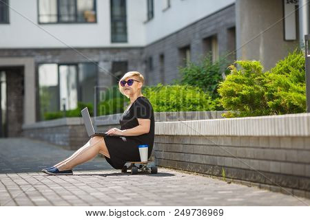 Woman Plus Size In Sunglasses Smiles On A Bright Sunny Day In The Street, A Haircut Is Creative, Ove