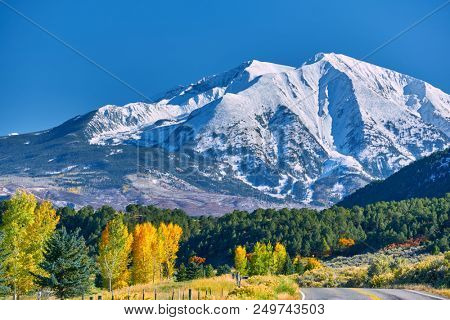 Highway in Colorado at autumn, USA. Mount Sopris landscape.