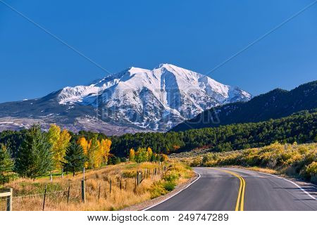 Highway in Colorado at autumn, USA. Mount Sopris landscape.