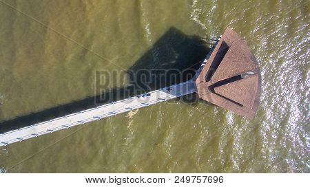 Aerial View Of The Wooden Pier Or Jetty With Hut At Esplanade In Sipitang Town,sabah Borneo,malaysia