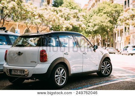 Barcelona, Spain - May 13, 2018: White Color Mini Cooper All 4 Car Parking In Street.