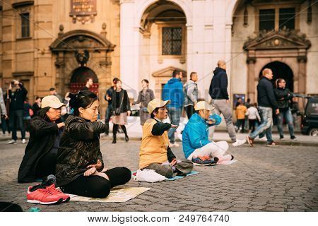 Prague, Czech Republic - September 23, 2017: Chinese People Are Engaged In Meditation Falun Gong Or 