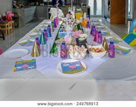 Essex, England, Uk - April 13, 2018: Large White Covered Table Set For Childrens Birthday Party