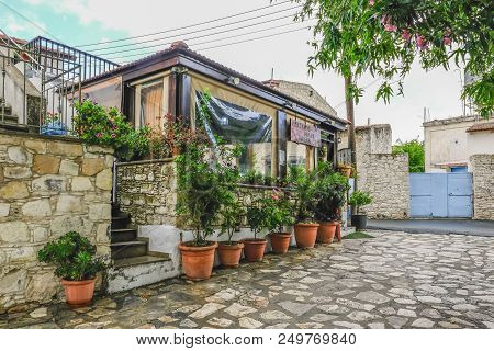 Lania, Cyprus - May 13, 2018: View Of The Small Platanos Restaurant In Lania On A Rainy Day.
