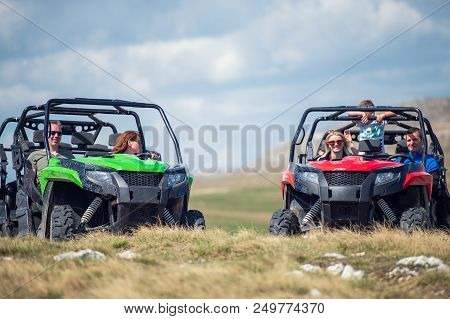 Friends Driving Off-road With Quad Bike Or Atv And Utv Vehicles.