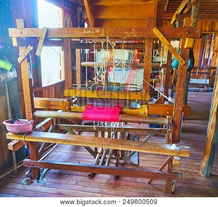 Inpawkhon, Myanmar - February 18, 2018: The Old Hand Loom With Unfinished Textile Piece In Hand Weav