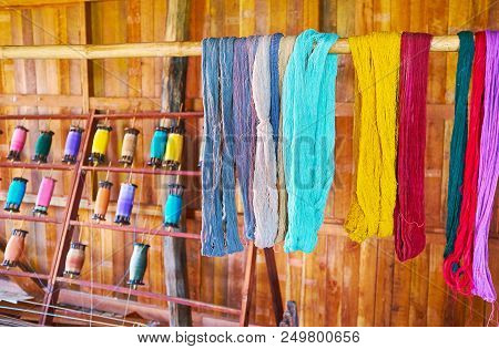 The Hand-dyed Cotton And Lotus Yarn Dries On The Wooden Pole In Texile Workshop Of Inpawkhon Village