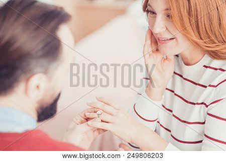 Proposal. Emotional Young Woman Smiling And Feeling Surprised While Getting An Engagement Ring From 