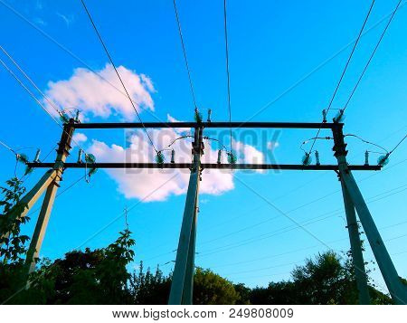 Electric Wires On A Support In A Blue Sky